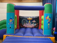 a large inflatable bouncer with a circus theme