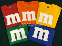 four m & m's t - shirts in different colors