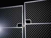 a chain link fence with a light on it