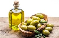 olive oil in a bowl with sprigs of sage