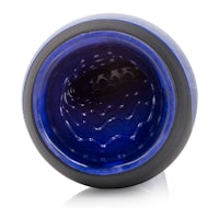 a blue glass bowl with a black lid