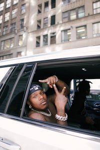 a man sitting in the back seat of a car