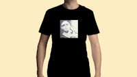 a man wearing a black t - shirt with a picture of a man
