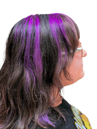 the back of a woman with purple dyed hair