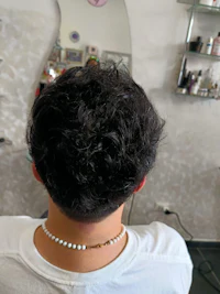 the back of a man's hair in a salon