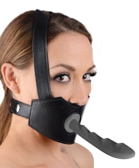 a woman wearing a black leather muzzle