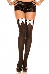 a woman in black stockings with white bows