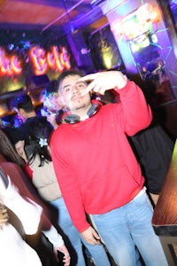 a man wearing a red sweater