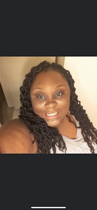 a woman with long hair is taking a selfie