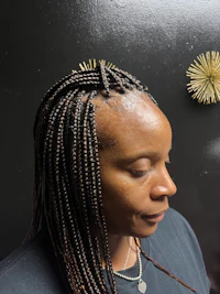 a woman with braids on her head