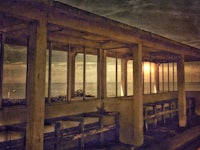 a bench with a view of the ocean