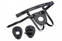 a pair of black leather harnesses and a pair of leather cuffs