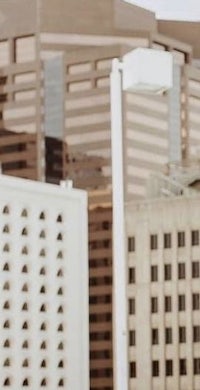 a woman is standing in front of a building