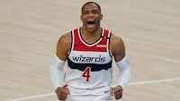 the washington wizards player is celebrating on the court