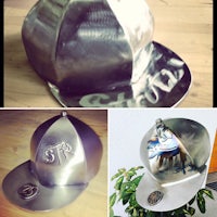 a metal hat with a logo on it
