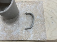 a mug with a handle on top of it