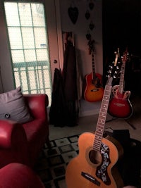 an acoustic guitar in a living room