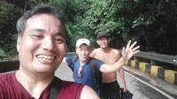 a group of people taking a selfie on a road