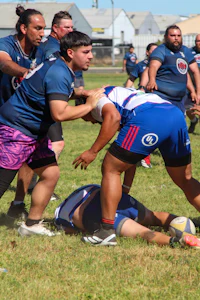 a group of people playing a game of rugby