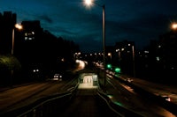 a city street at night with a street light