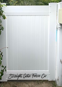 a white gate with the words straight gate fence co