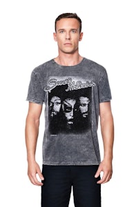 a man wearing a grey t - shirt with a black and white image