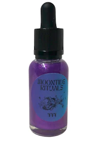 a bottle of purple liquid with the word moonshine on it