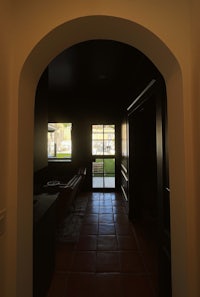 a view of a hallway with an archway