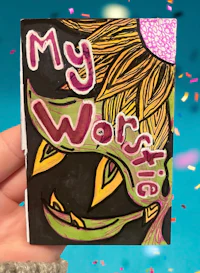 a hand holding up a card that says my worst