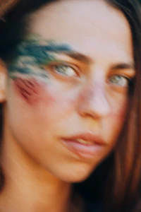 a woman with paint on her face