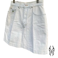 a white denim skirt hanging on a hanger