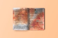 an open book on a peach background