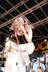 a woman on stage with dreadlocks