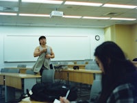 a woman standing in a classroom