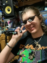 a man wearing sunglasses and a tee shirt
