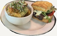 a bowl of soup and a sandwich on a plate