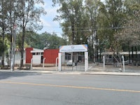 a building with a red and white sign in front of it