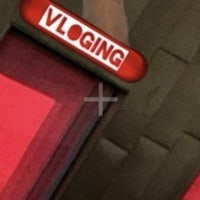 a person is standing in front of a door that says vlogging