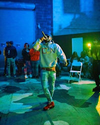 a man standing on a stage in front of a crowd