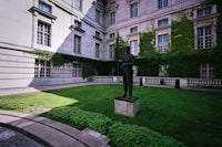 a statue in front of a building