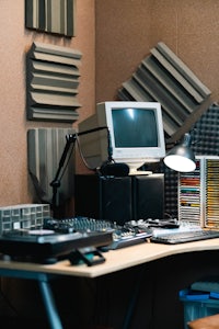 a recording studio with a computer and other equipment
