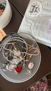 a tray of necklaces and bracelets on a table