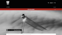 a black and white photo of a skier in the snow