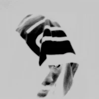 a black and white photo of a person wearing a hood
