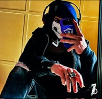 a person holding a cell phone in front of a mirror