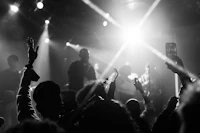 a black and white photo of a crowd at a concert