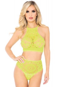 a woman wearing a lime lace lingerie and panties