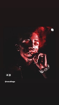 an image of a man smoking a cigarette on a black background