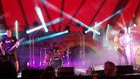a band performs on stage at a festival