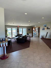 a lobby with a lot of tables and chairs